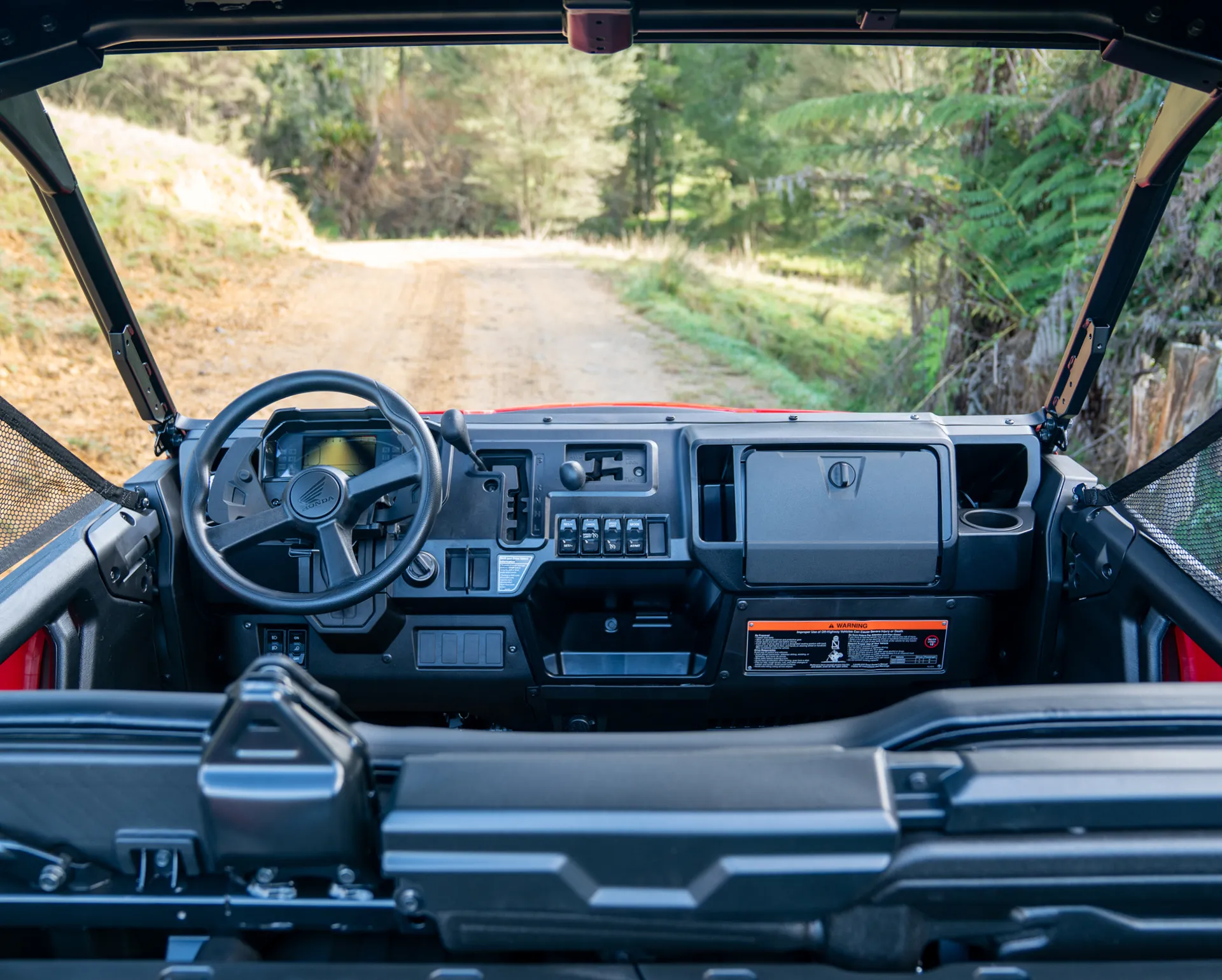 Honda Pioneer 1000 Deluxe interior with the new instrument panel and dash layout