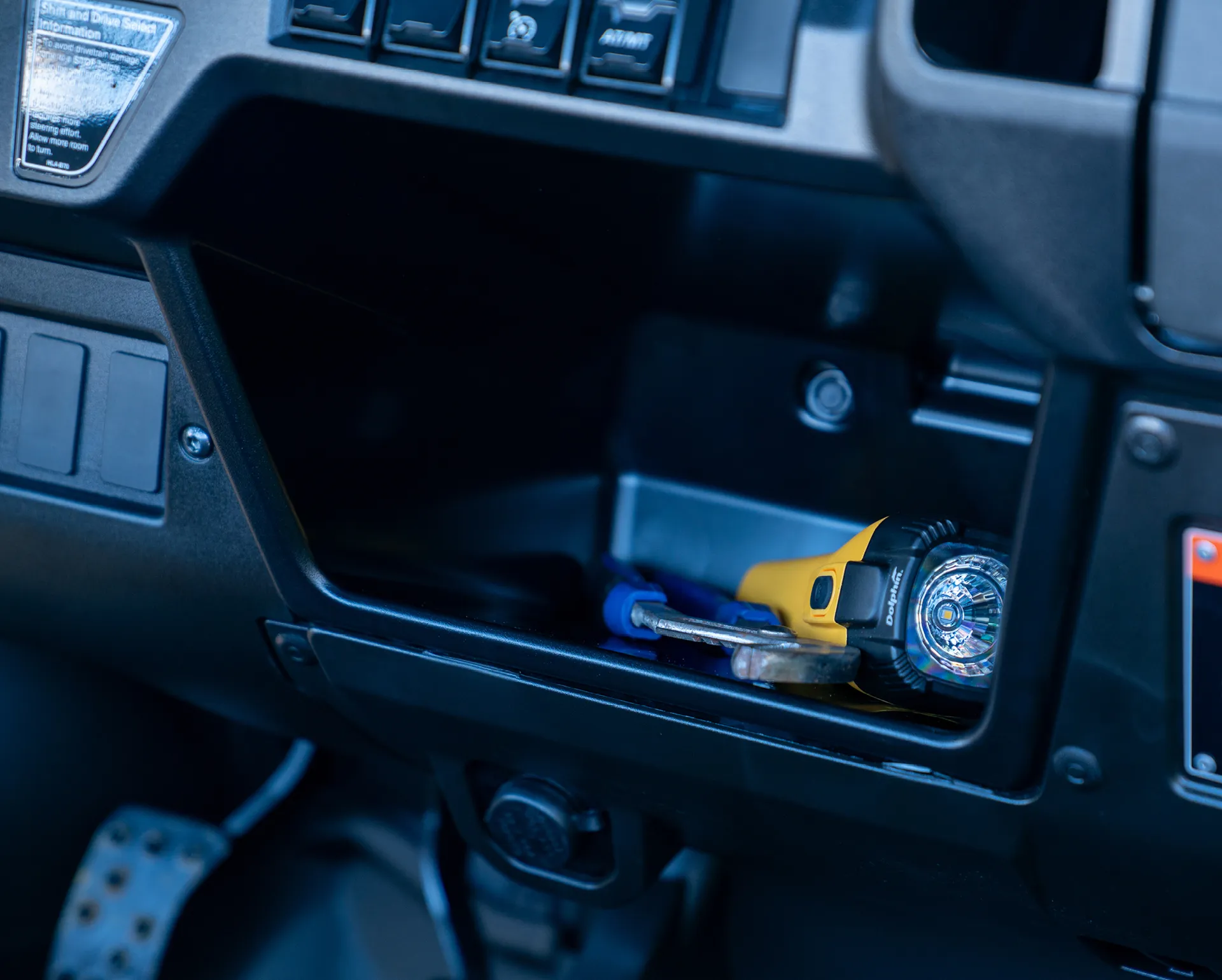 Honda Pioneer 1000 Deluxe under-dash storage shelf